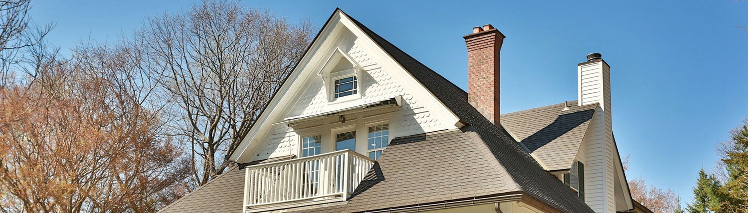 A chimney that looks fine from the yard but has hidden damage above the roofline