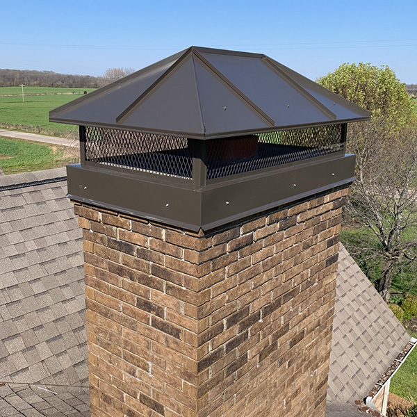 Chimney with a missing cap exposing the open flue on a DFW rooftop