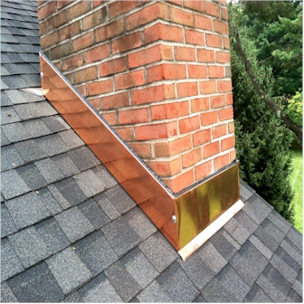 Rusted and lifting chimney flashing where the chimney meets a DFW roof