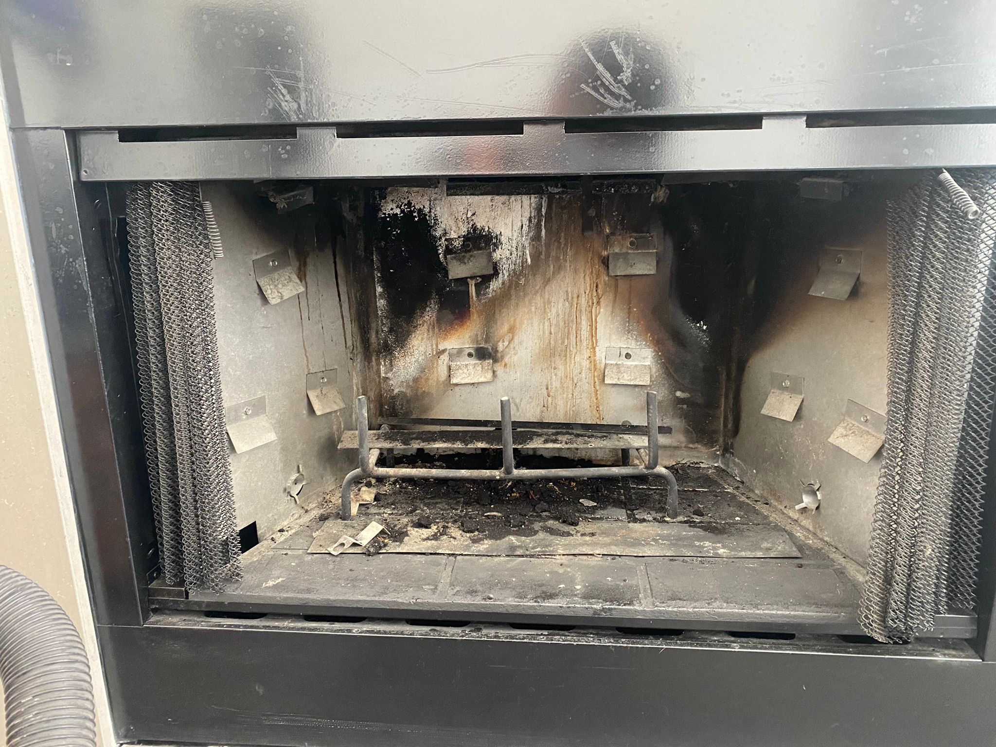 Failed refractory panels with cracks and separation before replacement
