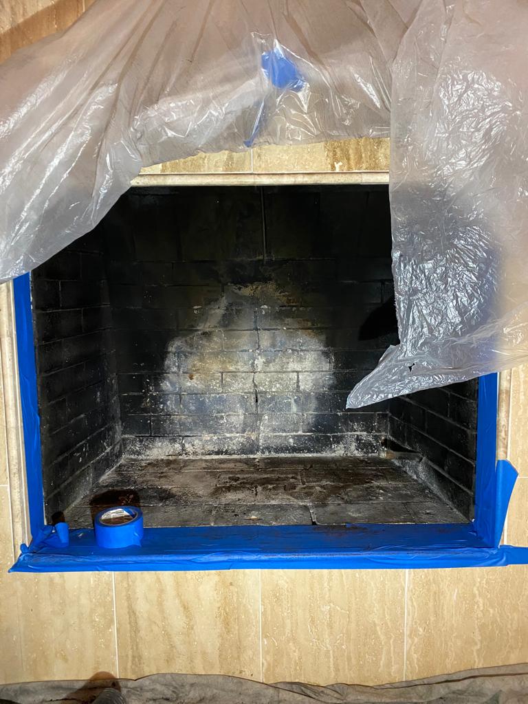 Worn firebox with deteriorated joints and heavy staining before repair